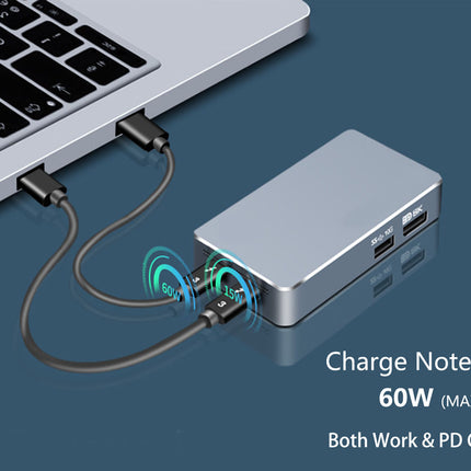 Laptop connected to a charging hub with text indicating power output and features.