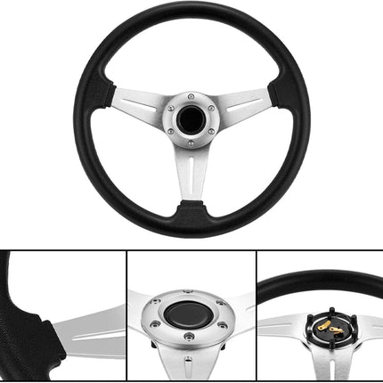 Black steering wheel with silver center on a white background