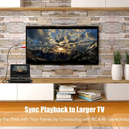 TV on a wooden stand with stone wall background, displaying a mountain scene.