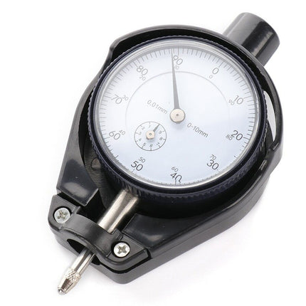 Dial indicator with a white face and black casing on a white background