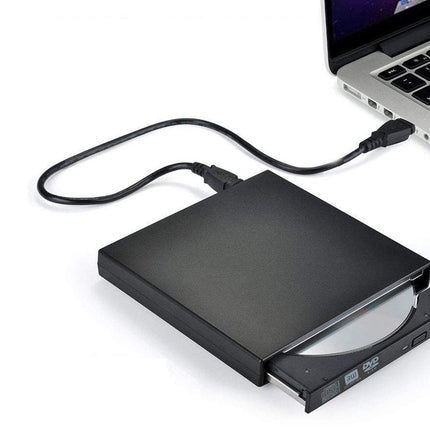 External DVD drive connected to a laptop on a white background
