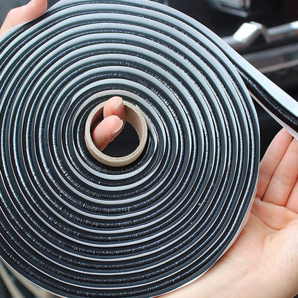 Roll of black and white foam sealant held by a person with a car interior background.