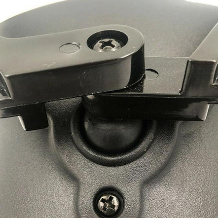 Close-up of a metal bracket with screws on a gray background