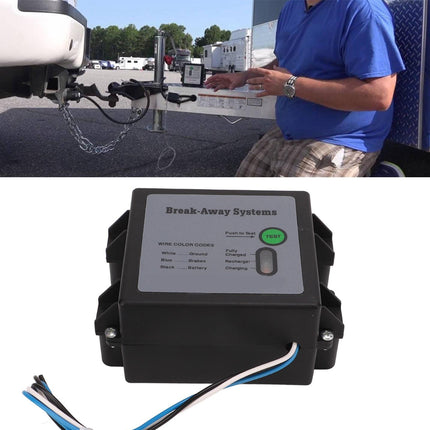 Break-away system control panel with wiring and a person working on an RV in the background.