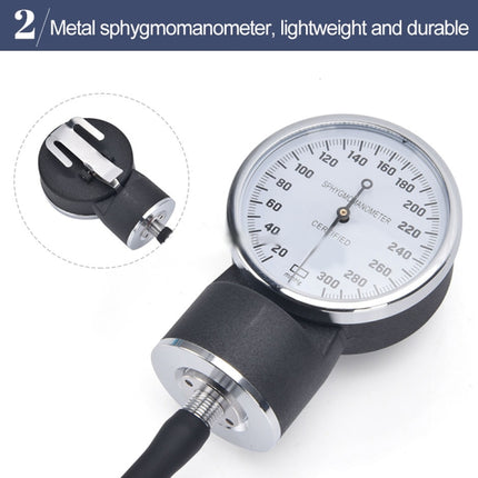 Metal sphygmomanometer with gauge and bulb on a white background