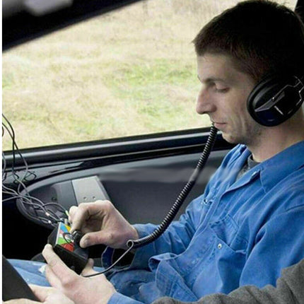 Person sitting in a car using a smartphone with a flexible phone holder, wearing headphones.
