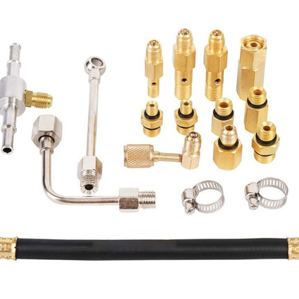 Collection of brass nozzles and connectors on a white background