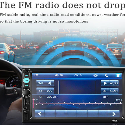 Car dashboard with an FM radio display during traffic, showing radio stations and navigation.