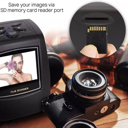 Film scanner with screen displaying a photo and SD card slot on a wooden surface.