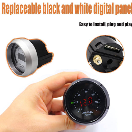 Digital panel meter held by a hand with text about replaceable black and white design.