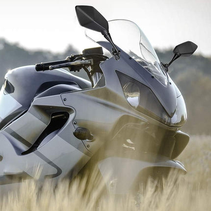 Motorcycle in a field with a blurred natural background