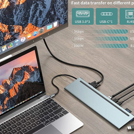 A silver 7-in-1 USB-C hub with multiple ports, shown connected to a laptop and a monitor on a wooden desk. The image includes informational text and icons highlighting its USB 3.