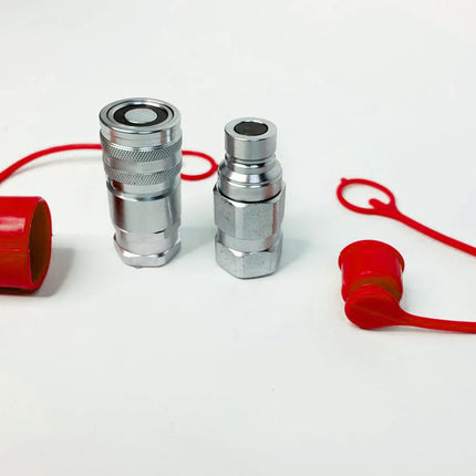 Two silver metal hydraulic quick-disconnect couplers with red plastic caps and red looped cords, displayed on a clean white background.
