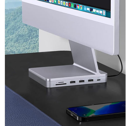 Computer monitor on a stand with multiple ports on a desk