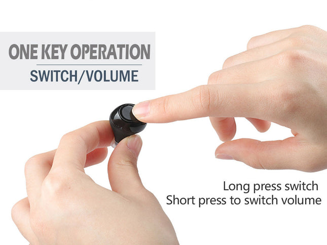 Small black switch being pressed by a finger with text on one key operation and switch volume.