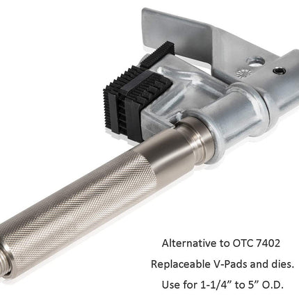 Metal tool with replaceable V-pads and dies on a white background