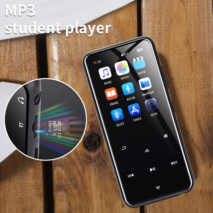 A black MP3 player with rounded corners, shown on a wooden surface with a circular inset highlighting its slim profile and a text overlay reading 'MP3 student player'.