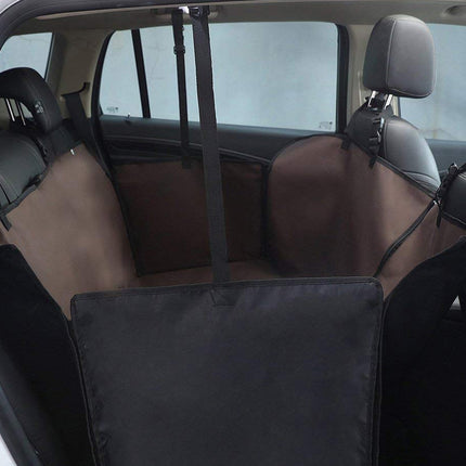 Car interior with a black pet barrier installed between two rows of seats.
