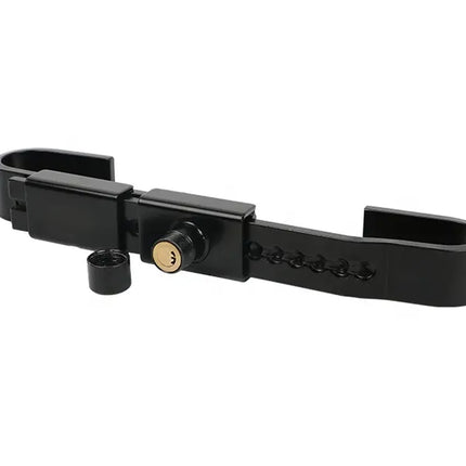 A black metal bicycle lock with a keyhole and a small detached black cap, shown on a plain white background.
