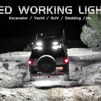 Jeep with LED working lights on a rocky terrain at night