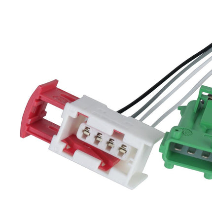 Two automotive connectors, one red and white, the other green, on a white background.