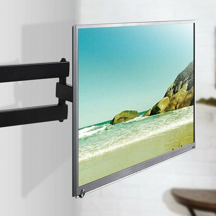 TV mounted on a wall with a beach scene displayed