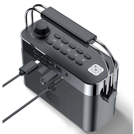 Black electronic device with control panel and power cable on a white background