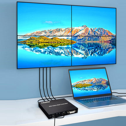 Laptop displaying a mountain landscape on a screen connected to a four-monitor setup.