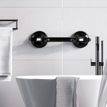 Bathroom setup with a black towel bar, white bathtub, and tiled wall.