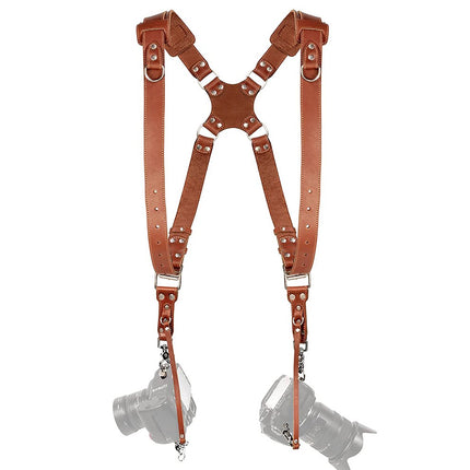 Brown leather camera shoulder harness on a white background