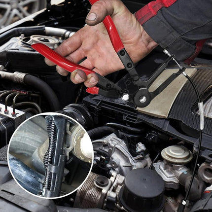 Person working on a car engine with a tool, close-up of tool shown.