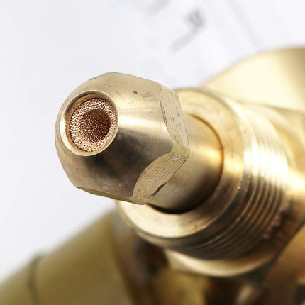 Close-up of a brass nozzle on a white background