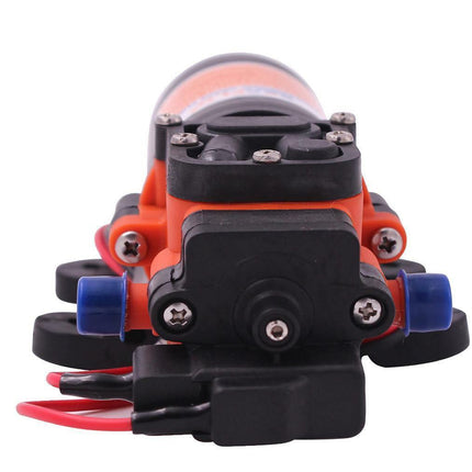 An electric pump motor with a black plastic body, orange casing, blue connectors, and red and black wires, shown on a white background.