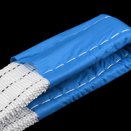 Roll of blue and white webbing on a black background