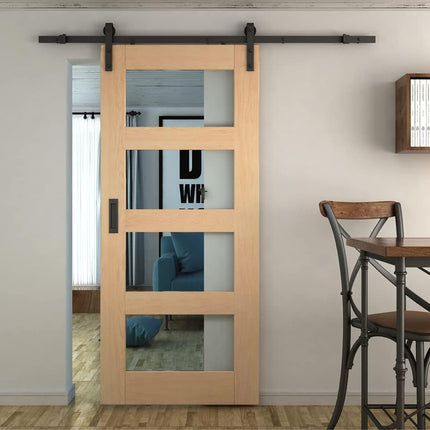 Wooden sliding door with glass panels in a room with a table and chair.