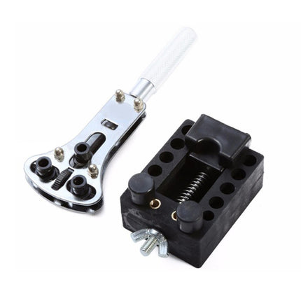 Mechanical tool set with a black component and silver wrench on a white background