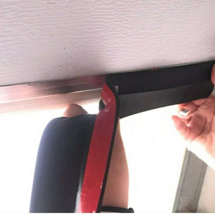 Person using a garage door seal strip on garage door
