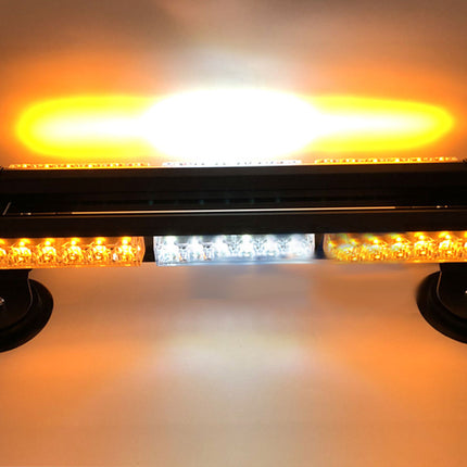 LED warning light bar with orange and white lights on a dark background