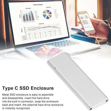 Type C SSD enclosure with laptop and smartphone on a desk