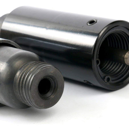 Two metal cylindrical components on a white background