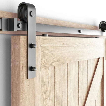 Wooden sliding barn door with metal track and hardware on a white background