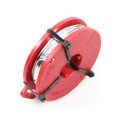 Red spool with metal cable on a white background