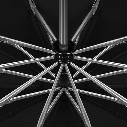 Close-up of a metallic wheel rim on a black background