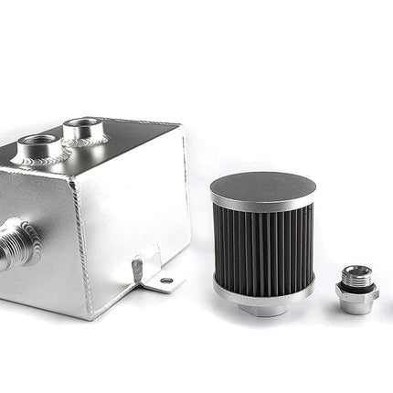 A silver aluminum fuel pump reservoir tank with two threaded ports, shown alongside a black ribbed cylindrical air filter and two small metal fittings on a clean white background.