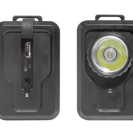 A black rectangular portable power bank or charging device shown from two angles on a white background: the left view shows a vertical USB-C port with a strap closure, and the right view shows a circular LED light face with a yellow-green lens.