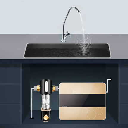 Under-sink water filtration system with a kitchen sink and running water.