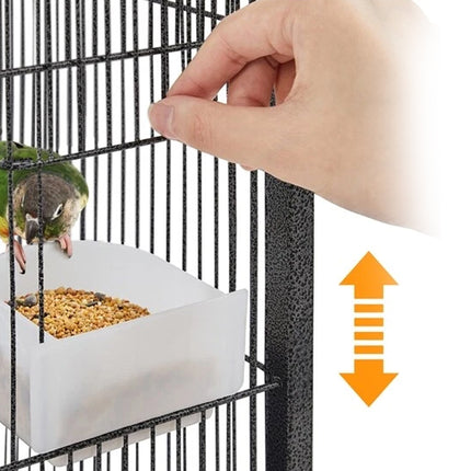 Bird perched on a perch inside a birdcage with a hand reaching towards it, featuring an arrow indicating height adjustment.
