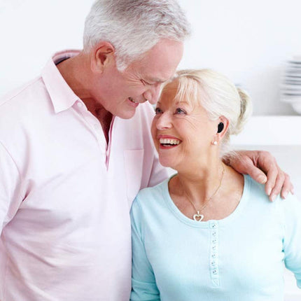 Senior couple smiling and embracing each other