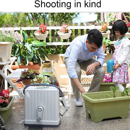 Man and child tending to plants in a garden setting with a portable water tank.