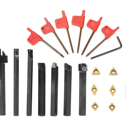 Set of metal tools and components on a white background